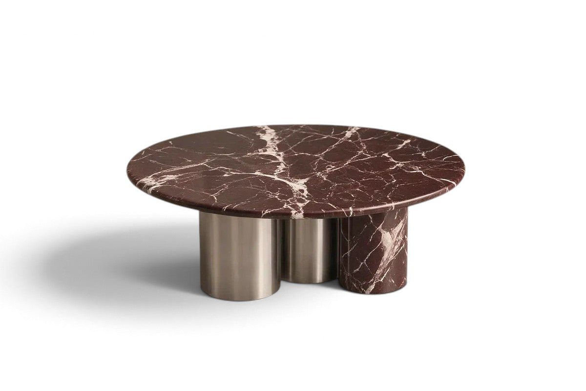 rosso levanto marble coffee table. round marble coffee table. luxury marble coffee table. designer coffee table. mixed material coffee table. sculptural coffee table. custom marble coffee table. Rosso Levanto marble round coffee table with sculptural mixed-material cylindrical legs. Luxury round coffee table in Rosso Levanto marble with sculptural base. Rosso Levanto marble coffee table for luxury interior design projects. Designer Round Marble Coffee Table in Rosso Levanto.