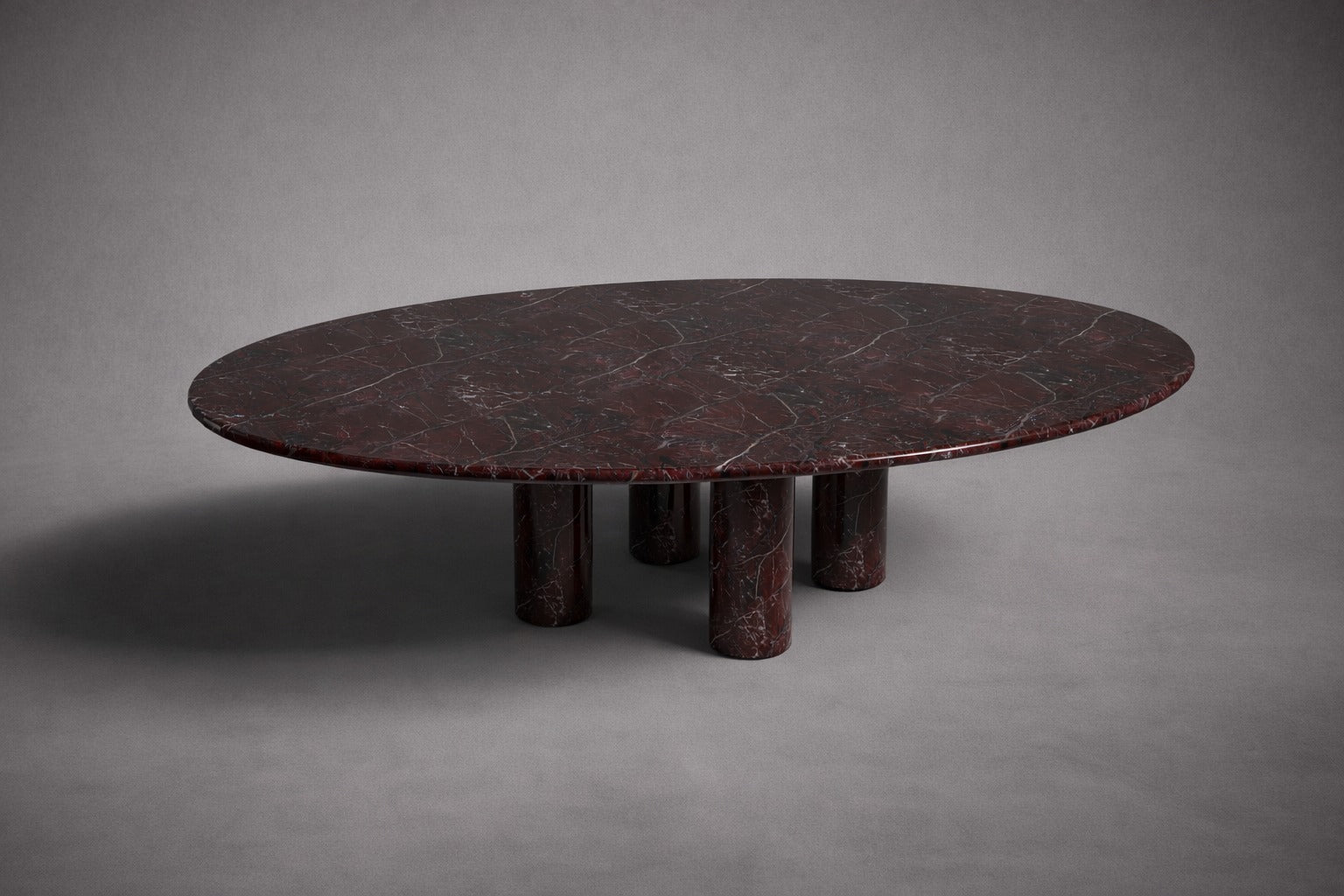 red marble dining table. oval red marble dining table. red marble table. large marble dining table. red marble living room table. red marble large dining table. custom marble dining table. custom marble table.