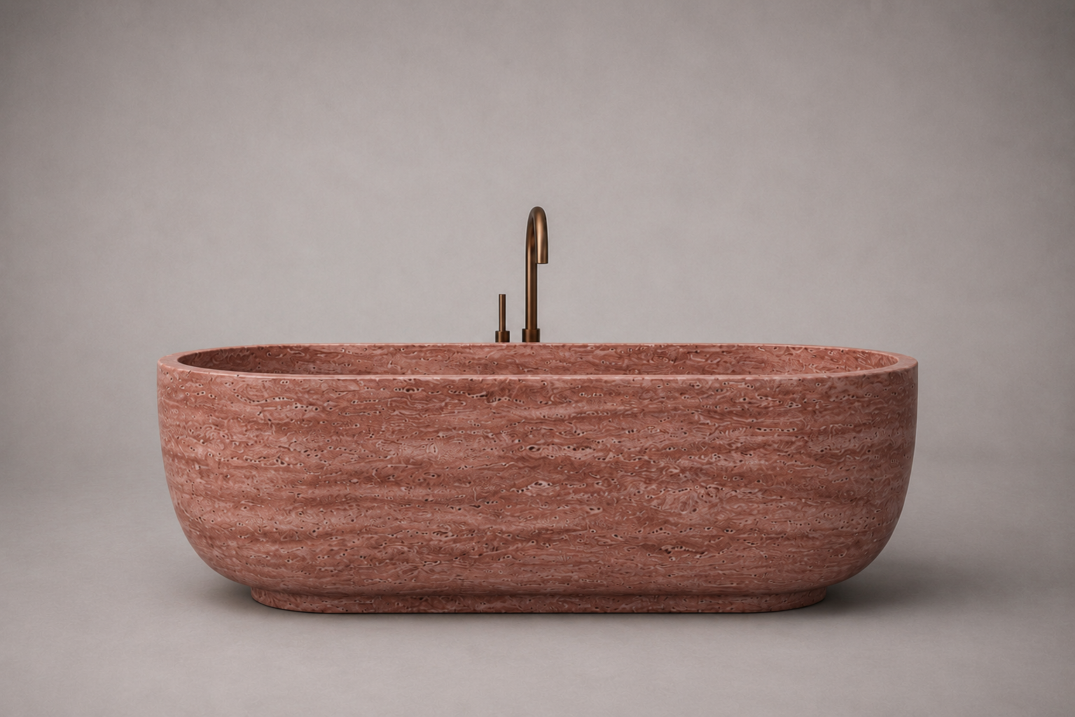 freestanding red travertine bathtub in honed natural stone with sculptural oval silhouette. Freestanding red travertine bathtub in warm beige natural stone. Custom red travertine bathtub handcrafted from natural stone. Luxury natural stone bathtub with minimalist oval form. Handcrafted red travertine bathtub for luxury bathroom design. Bespoke freestanding red travertine bathtub for interior design projects. Custom luxury red travertine bathtub for high end interior.