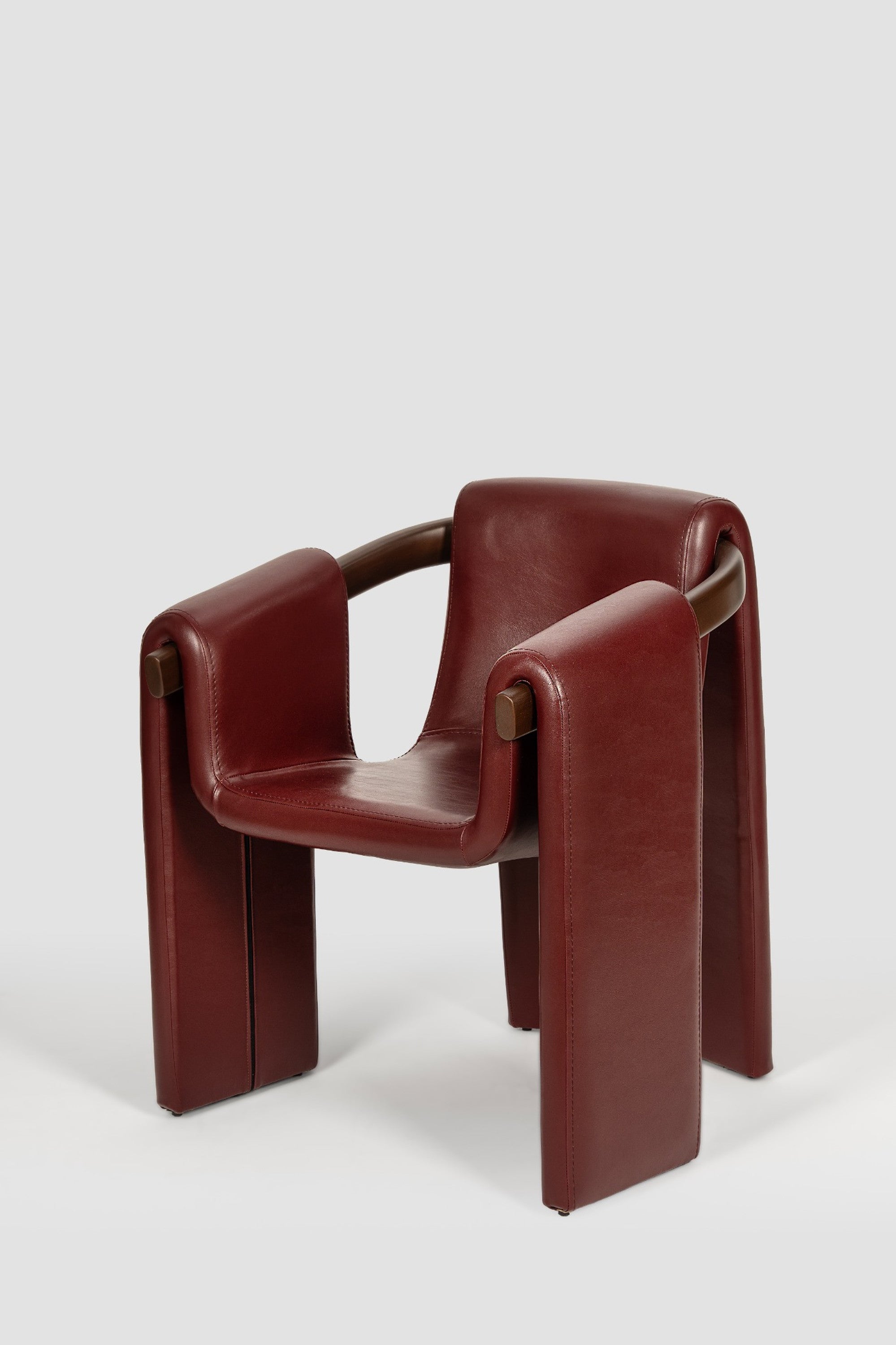 luxury leather dining chair. custom leather dining chair. modern leather dining chair. sculptural dining chair. designer dining chair. high end dining chair. contemporary leather armchair. bespoke dining chair. premium leather seating. architectural dining chair. burgundy leather dining chair. custom luxury leather dining chair USA. made to order leather dining chairs. modern sculptural leather arm dining chair. high end custom seating for interior designers. luxury restaurant leather dining chairs.