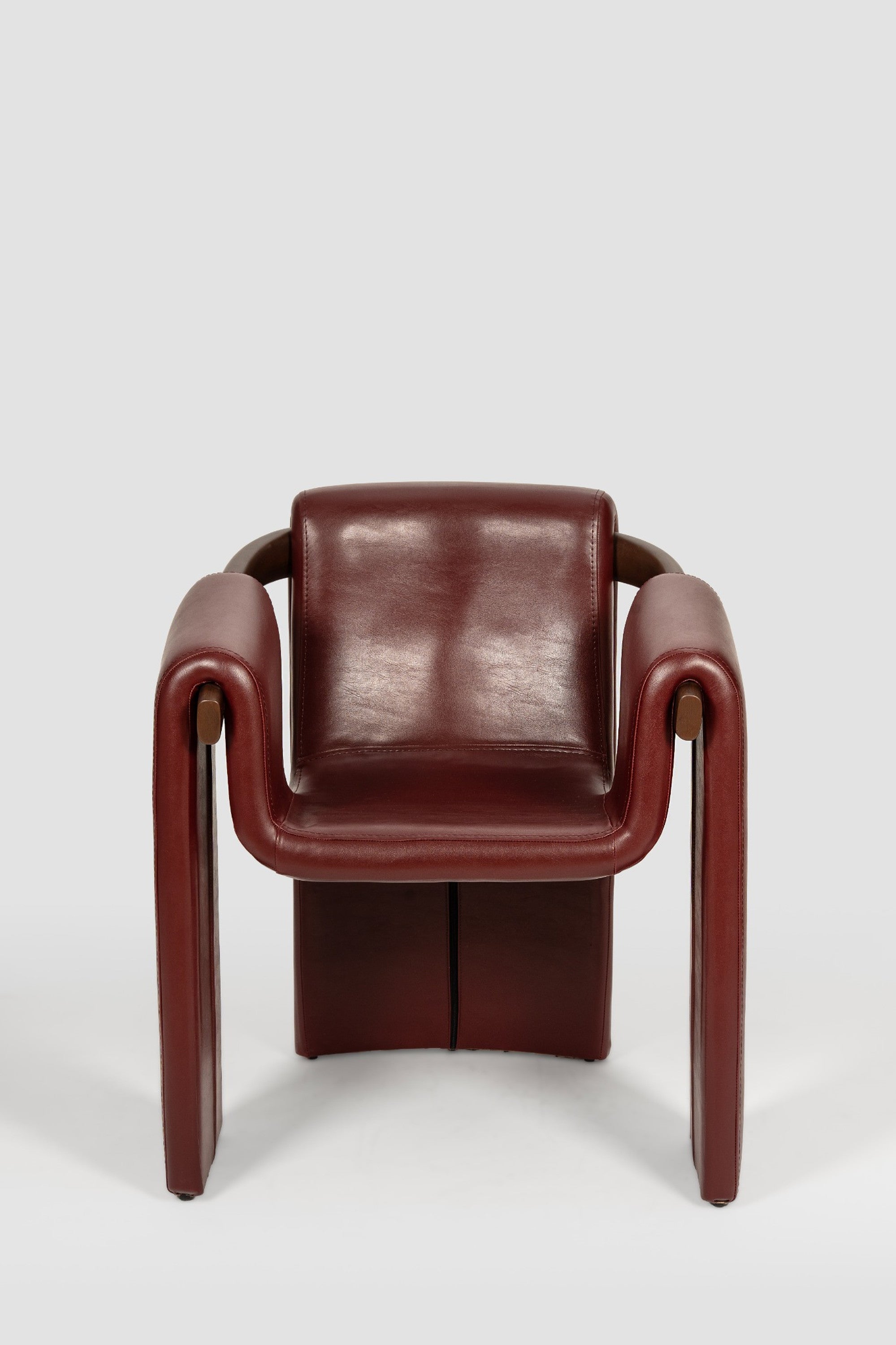 luxury leather dining chair. custom leather dining chair. modern leather dining chair. sculptural dining chair. designer dining chair. high end dining chair. contemporary leather armchair. bespoke dining chair. premium leather seating. architectural dining chair. burgundy leather dining chair. custom luxury leather dining chair USA. made to order leather dining chairs. modern sculptural leather arm dining chair. high end custom seating for interior designers. luxury restaurant leather dining chairs.