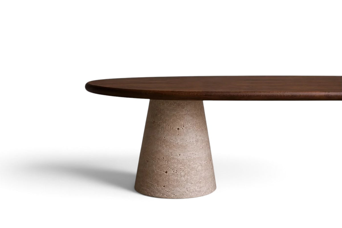 luxury wood oval dining table with walnut top and travertine base.walnut wood oval dining table with sculptural travertine legs. designer wood dining table with travertine supports. oval walnut dining table for luxury interiors. custom wood dining table with travertine legs. premium walnut dining table with natural stone base. architectural oval dining table in walnut wood and travertine. luxury walnut wood dining table for bespoke interiors. wood oval dining table with travertine pedestal supports.