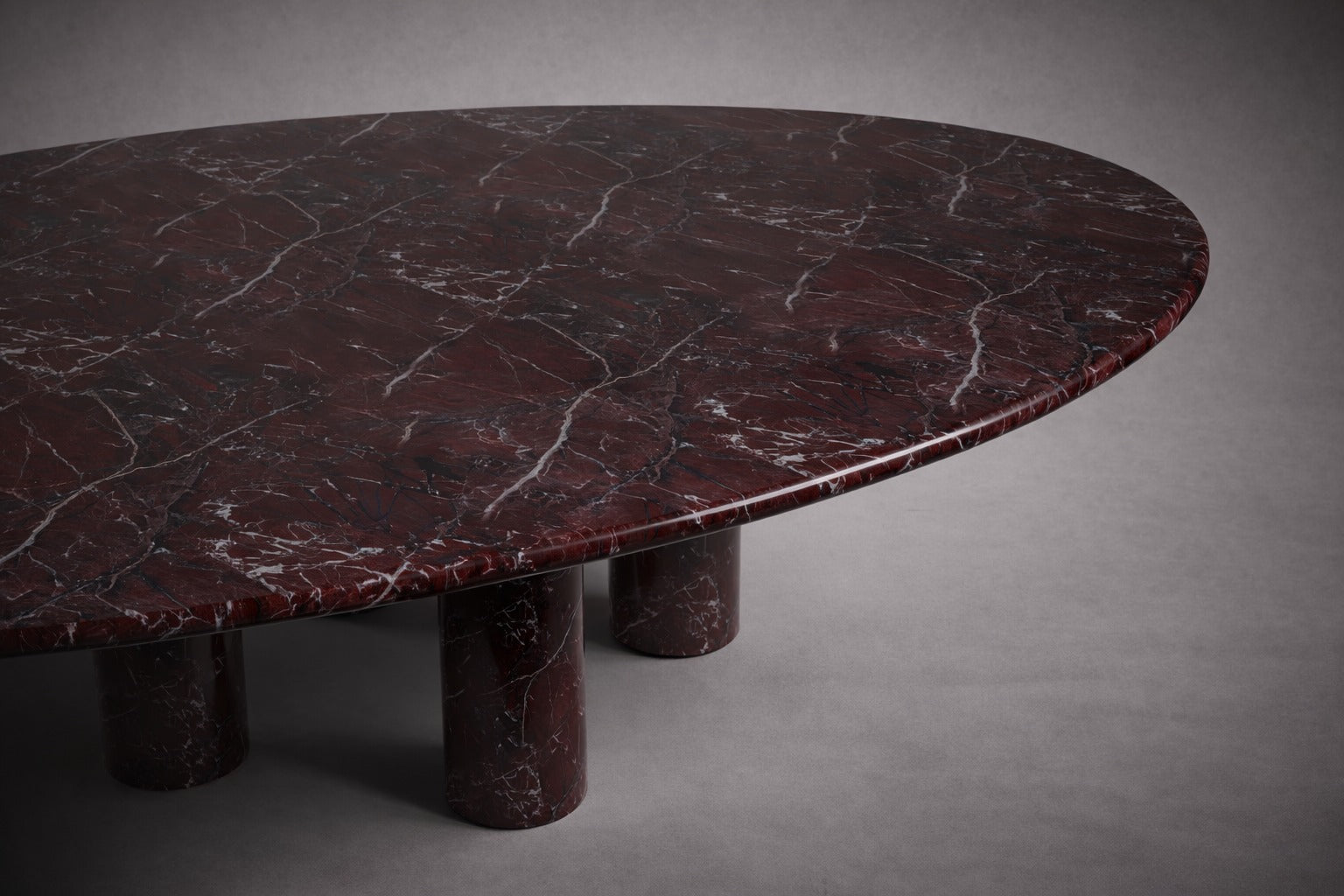 red marble dining table. oval red marble dining table. red marble table. large marble dining table. red marble living room table. red marble large dining table. custom marble dining table. custom marble table.