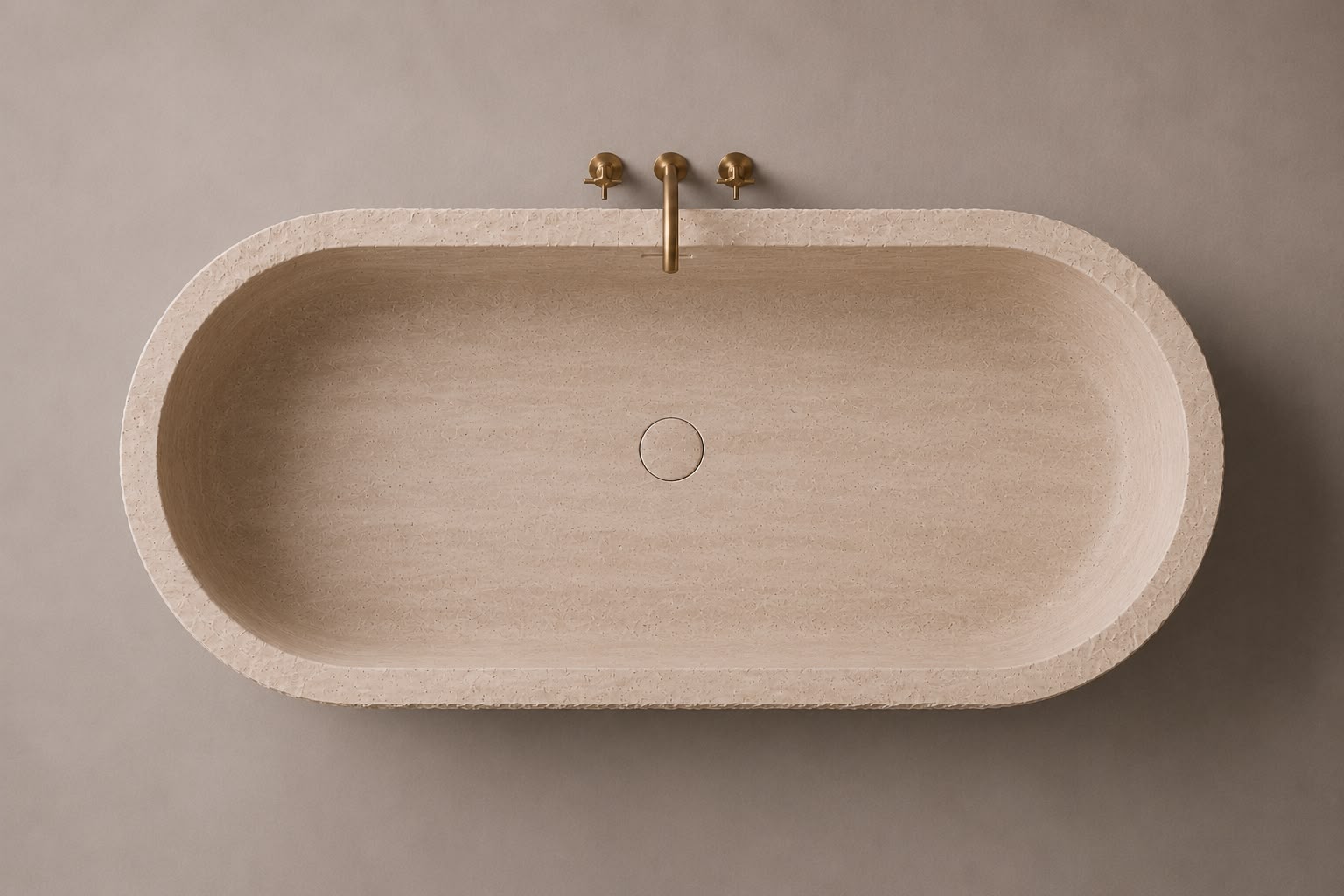 freestanding travertine bathtub in honed natural stone with sculptural oval silhouette. Freestanding travertine bathtub in warm beige natural stone. Custom travertine bathtub handcrafted from natural stone. Luxury natural stone bathtub with minimalist oval form. Handcrafted travertine bathtub for luxury bathroom design. Bespoke freestanding travertine bathtub for interior design projects. Natural stone freestanding bathtub in premium travertine finish. Custom luxury travertine bathtub for high end interior
