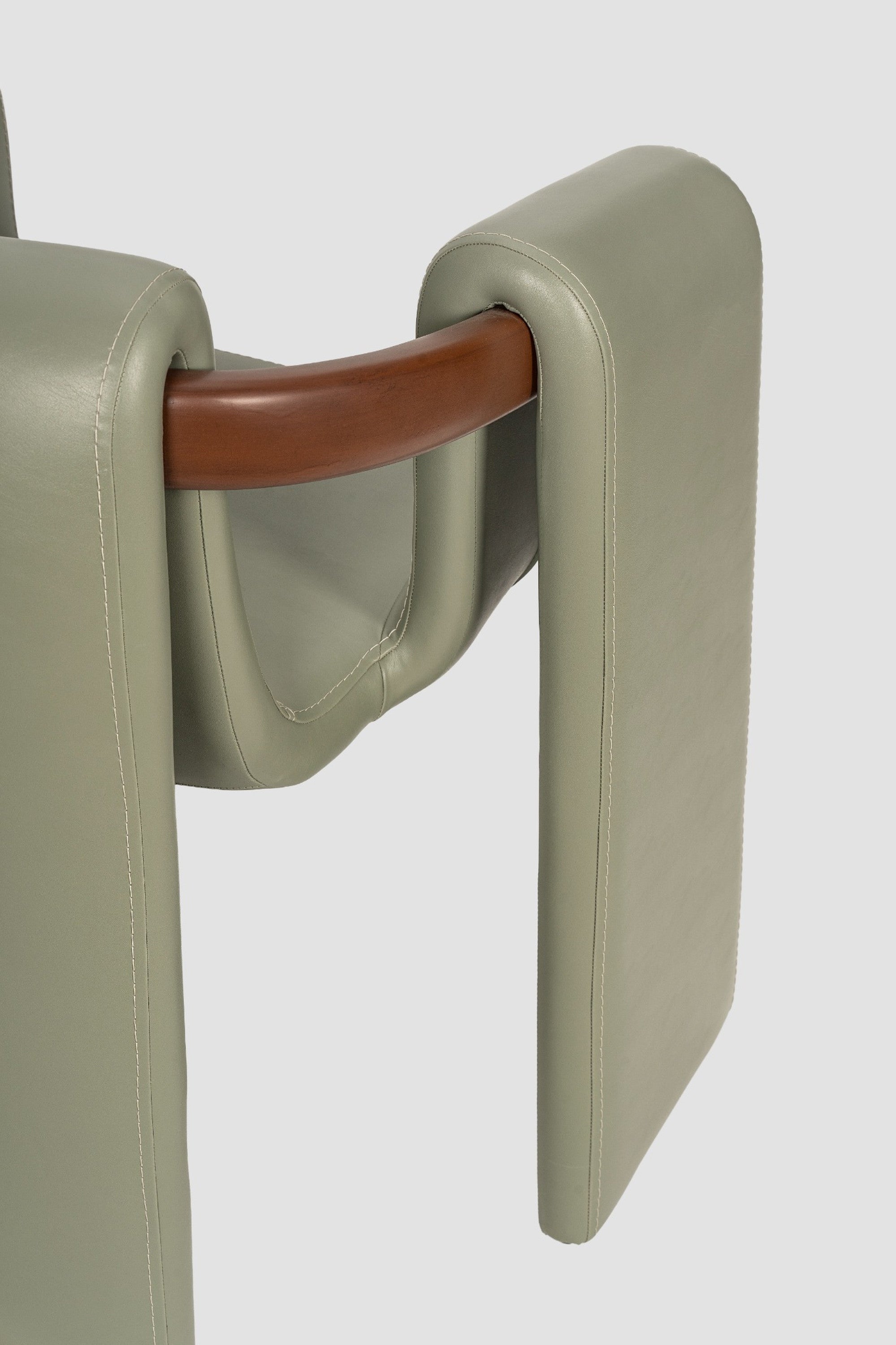 luxury leather dining chair. custom leather dining chair. modern leather dining chair. sculptural dining chair. designer dining chair. high end dining chair. contemporary leather armchair. bespoke dining chair. premium leather seating. architectural dining chair. burgundy leather dining chair. custom luxury leather dining chair USA. made to order leather dining chairs. modern sculptural leather arm dining chair. high end custom seating for interior designers. luxury restaurant leather dining chairs.