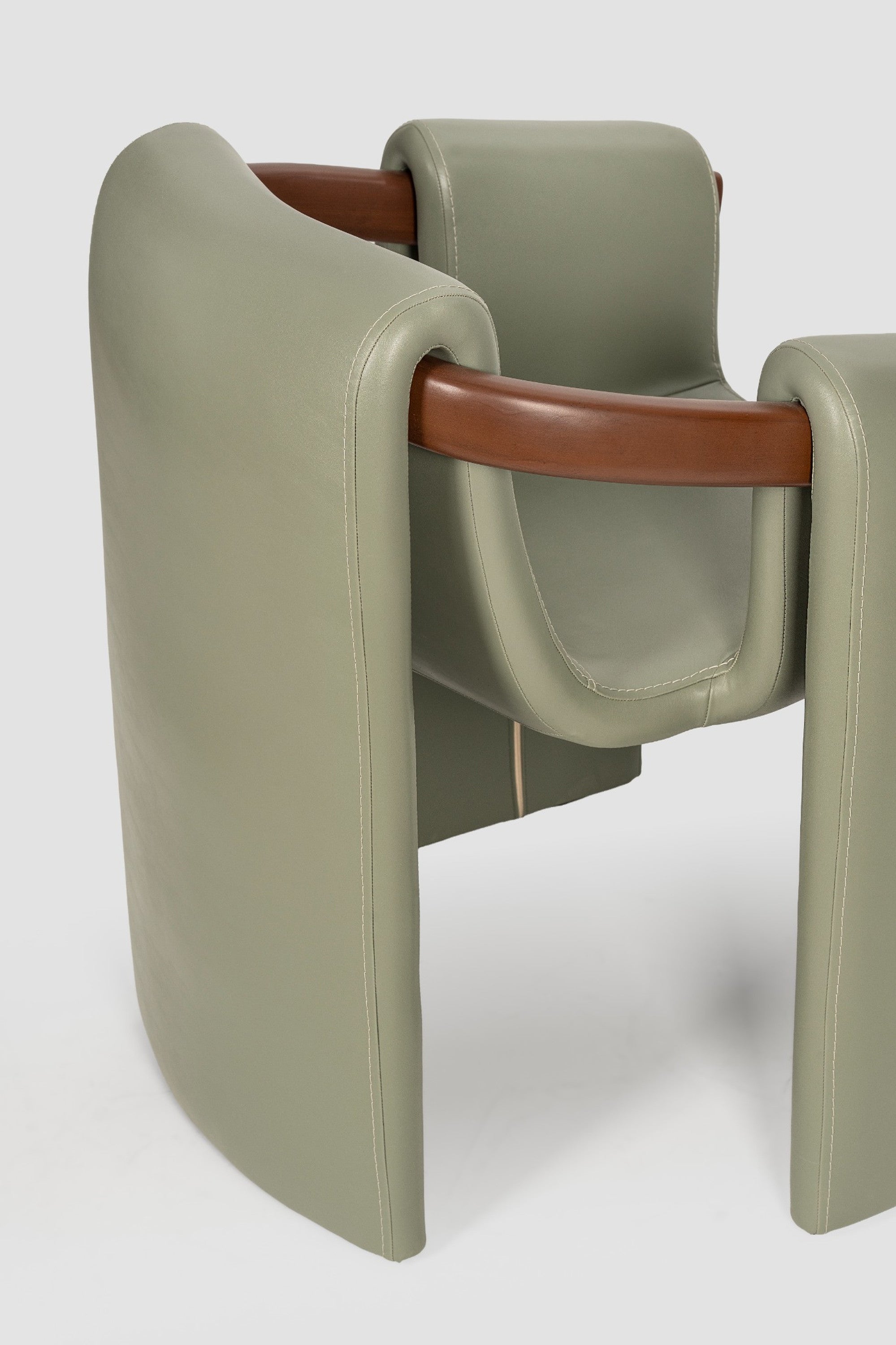 luxury leather dining chair. custom leather dining chair. modern leather dining chair. sculptural dining chair. designer dining chair. high end dining chair. contemporary leather armchair. bespoke dining chair. premium leather seating. architectural dining chair. burgundy leather dining chair. custom luxury leather dining chair USA. made to order leather dining chairs. modern sculptural leather arm dining chair. high end custom seating for interior designers. luxury restaurant leather dining chairs.