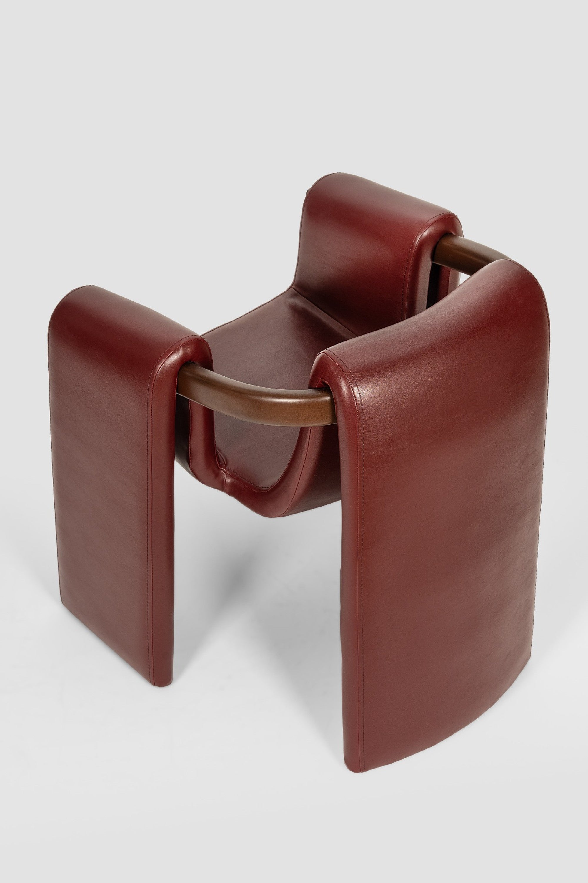 luxury leather dining chair. custom leather dining chair. modern leather dining chair. sculptural dining chair. designer dining chair. high end dining chair. contemporary leather armchair. bespoke dining chair. premium leather seating. architectural dining chair. burgundy leather dining chair. custom luxury leather dining chair USA. made to order leather dining chairs. modern sculptural leather arm dining chair. high end custom seating for interior designers. luxury restaurant leather dining chairs.