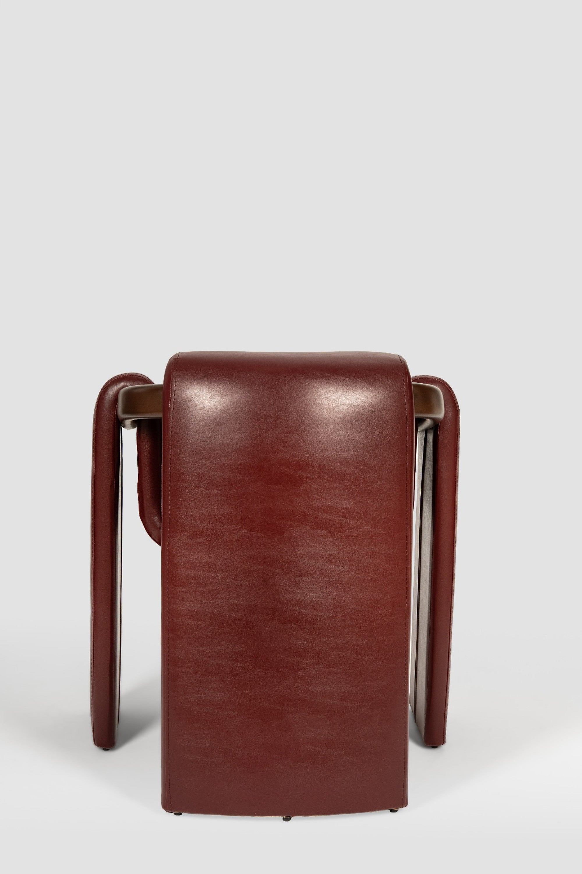 luxury leather dining chair. custom leather dining chair. modern leather dining chair. sculptural dining chair. designer dining chair. high end dining chair. contemporary leather armchair. bespoke dining chair. premium leather seating. architectural dining chair. burgundy leather dining chair. custom luxury leather dining chair USA. made to order leather dining chairs. modern sculptural leather arm dining chair. high end custom seating for interior designers. luxury restaurant leather dining chairs.