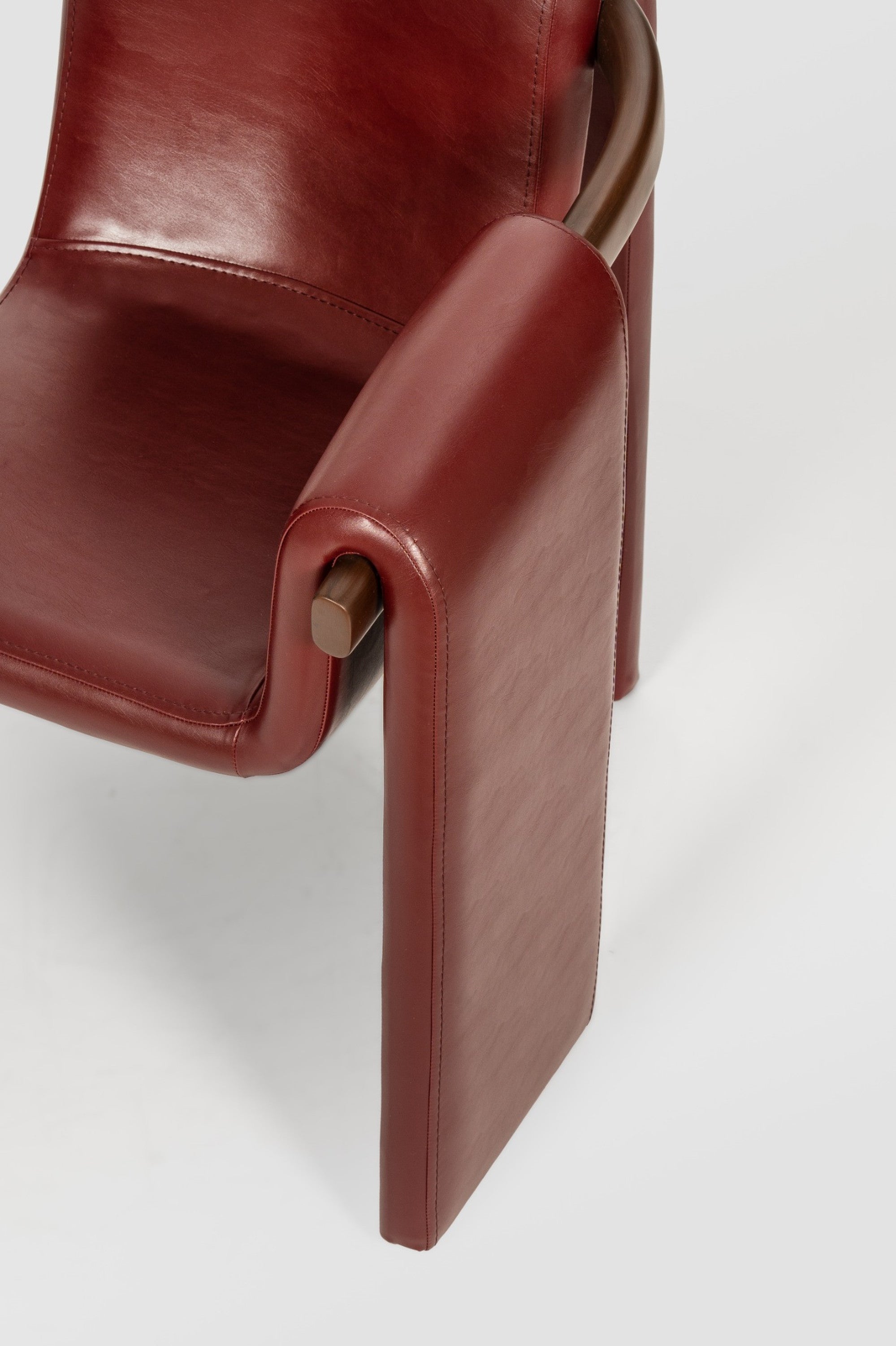 luxury leather dining chair. custom leather dining chair. modern leather dining chair. sculptural dining chair. designer dining chair. high end dining chair. contemporary leather armchair. bespoke dining chair. premium leather seating. architectural dining chair. burgundy leather dining chair. custom luxury leather dining chair USA. made to order leather dining chairs. modern sculptural leather arm dining chair. high end custom seating for interior designers. luxury restaurant leather dining chairs.