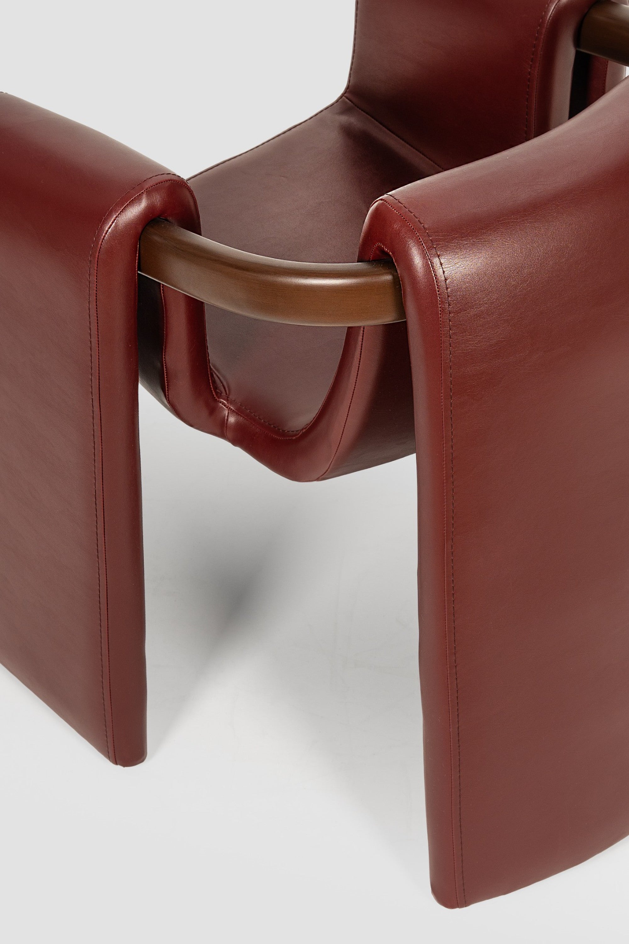 luxury leather dining chair. custom leather dining chair. modern leather dining chair. sculptural dining chair. designer dining chair. high end dining chair. contemporary leather armchair. bespoke dining chair. premium leather seating. architectural dining chair. burgundy leather dining chair. custom luxury leather dining chair USA. made to order leather dining chairs. modern sculptural leather arm dining chair. high end custom seating for interior designers. luxury restaurant leather dining chairs.