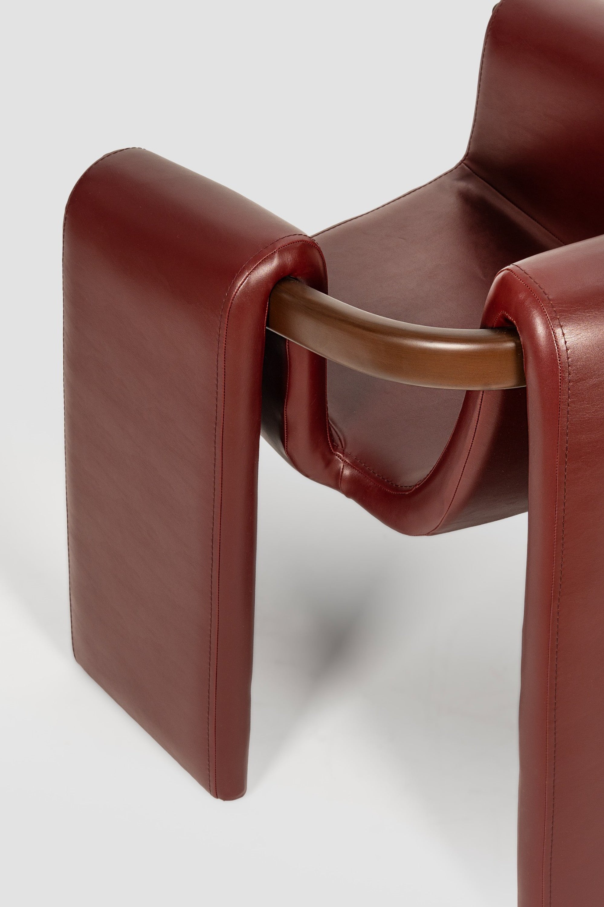 luxury leather dining chair. custom leather dining chair. modern leather dining chair. sculptural dining chair. designer dining chair. high end dining chair. contemporary leather armchair. bespoke dining chair. premium leather seating. architectural dining chair. burgundy leather dining chair. custom luxury leather dining chair USA. made to order leather dining chairs. modern sculptural leather arm dining chair. high end custom seating for interior designers. luxury restaurant leather dining chairs.