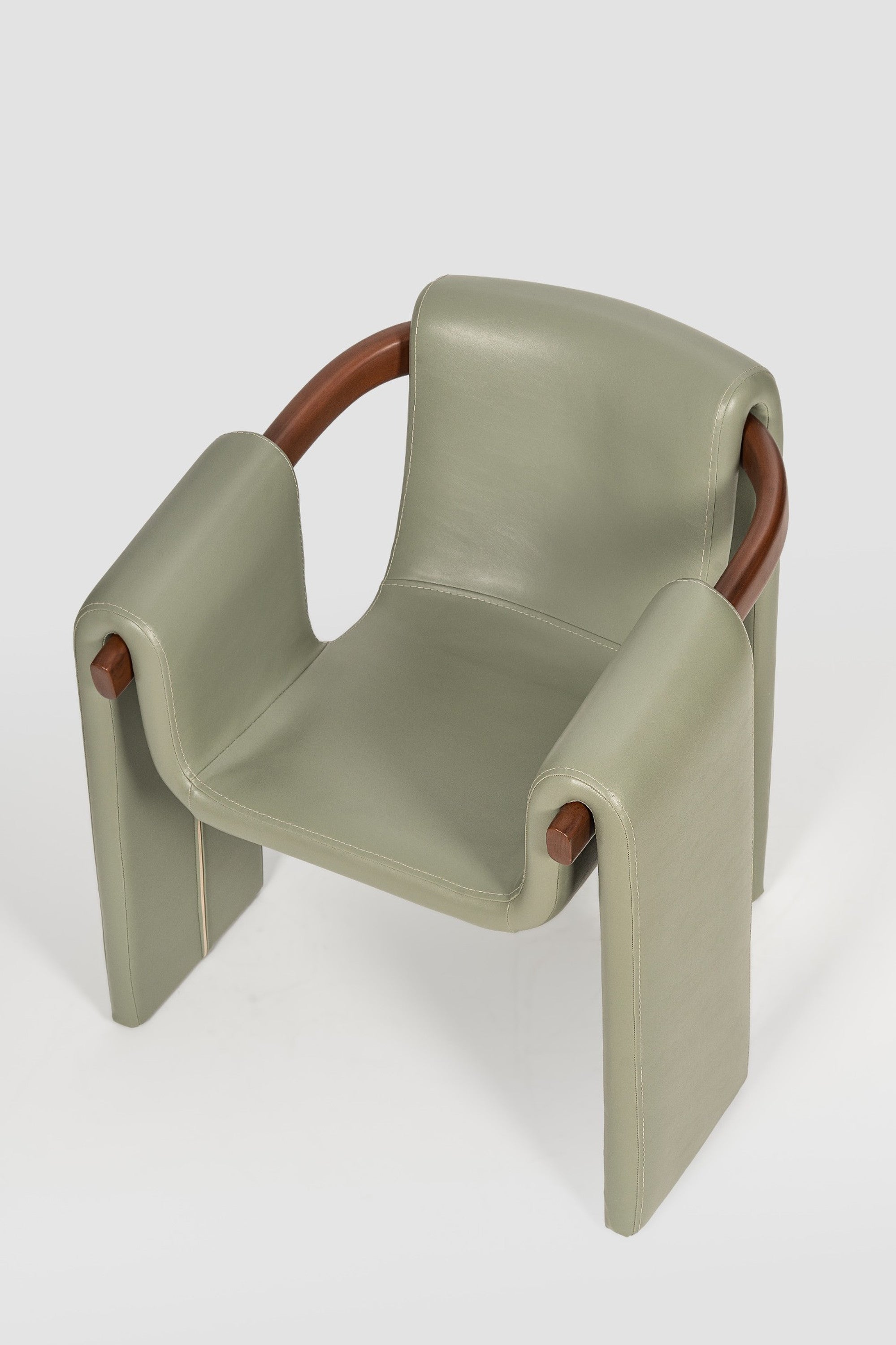 luxury leather dining chair. custom leather dining chair. modern leather dining chair. sculptural dining chair. designer dining chair. high end dining chair. contemporary leather armchair. bespoke dining chair. premium leather seating. architectural dining chair. burgundy leather dining chair. custom luxury leather dining chair USA. made to order leather dining chairs. modern sculptural leather arm dining chair. high end custom seating for interior designers. luxury restaurant leather dining chairs.