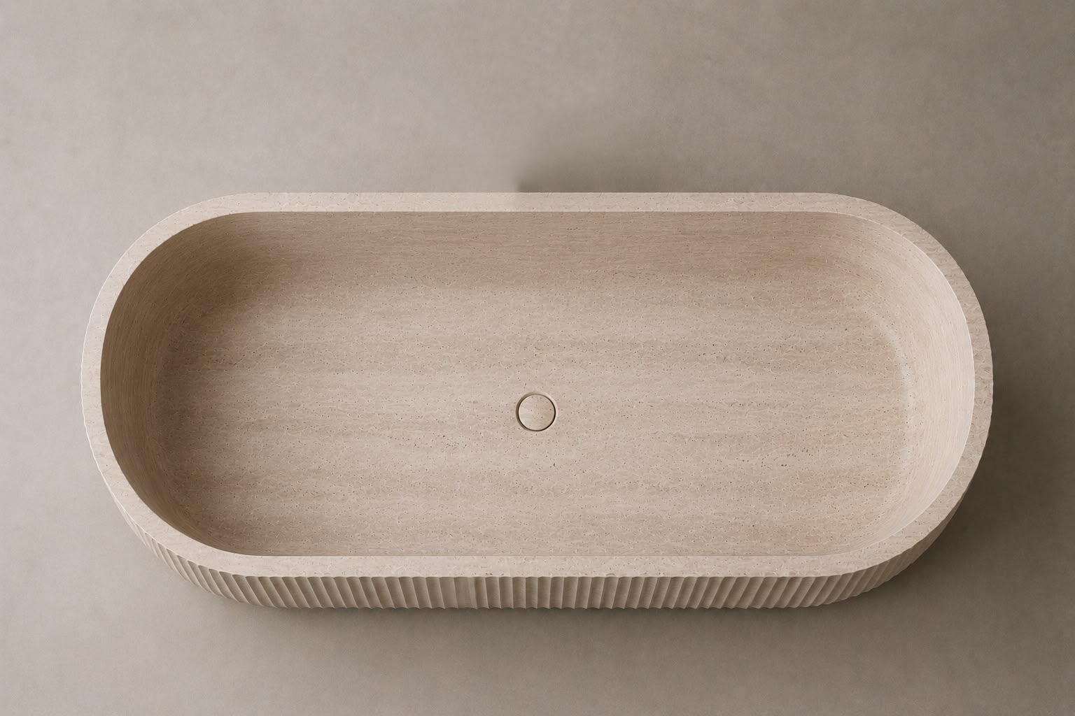 freestanding travertine bathtub in honed natural stone with sculptural oval silhouette. Freestanding travertine bathtub in warm beige natural stone. Custom travertine bathtub handcrafted from natural stone. Luxury natural stone bathtub with minimalist oval form. Handcrafted travertine bathtub for luxury bathroom design. Bespoke freestanding travertine bathtub for interior design projects. Natural stone freestanding bathtub in premium travertine finish. Custom luxury travertine bathtub for high end interior
